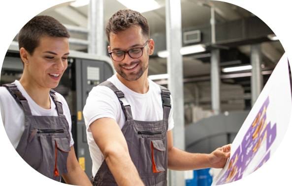 Printing and shipping company employees add collateral to order. Book print on demand services.